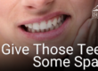 woman holding jaw in pain
