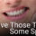 woman holding jaw in pain