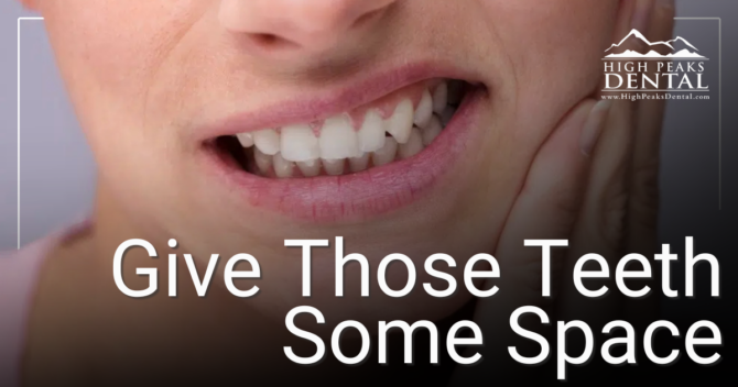 Give Those Teeth Some Space woman holding jaw in pain