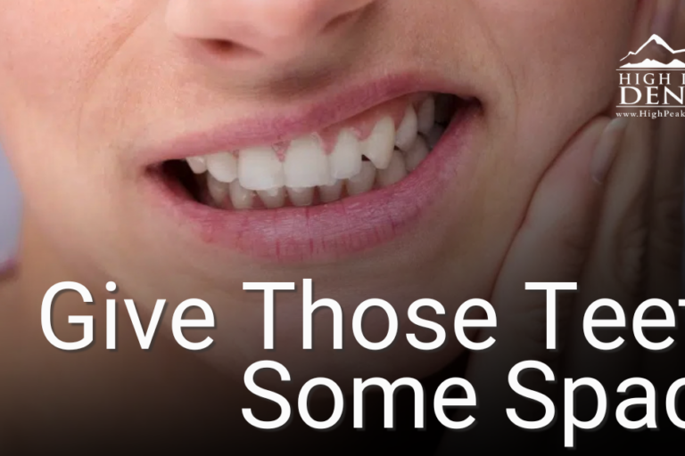 woman holding jaw in pain